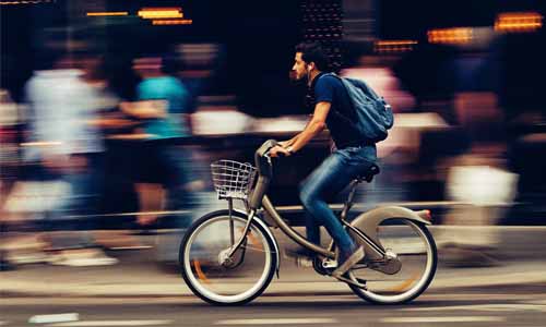 Man riding a bike on the street