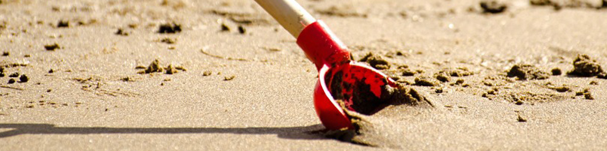 Red Shovel in the Sand
