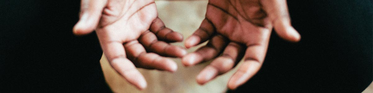 Hands open receiving prayer