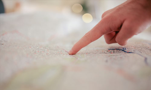 Person pointing at map