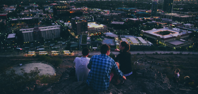 3 People Looking out at the City
