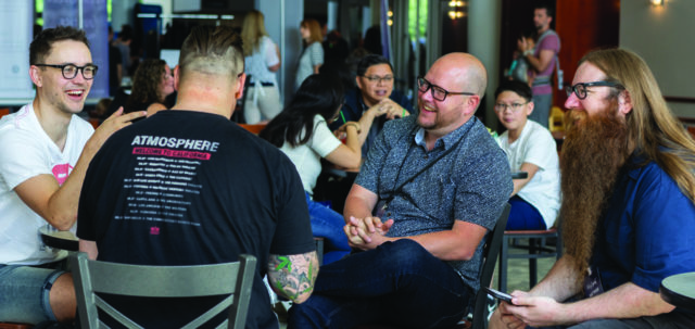4 Men talking together at a Vineyard Conference